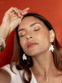 Boucles d'oreilles guêpiers d'Afrique sur palmiers blancs><noscript><img width=
