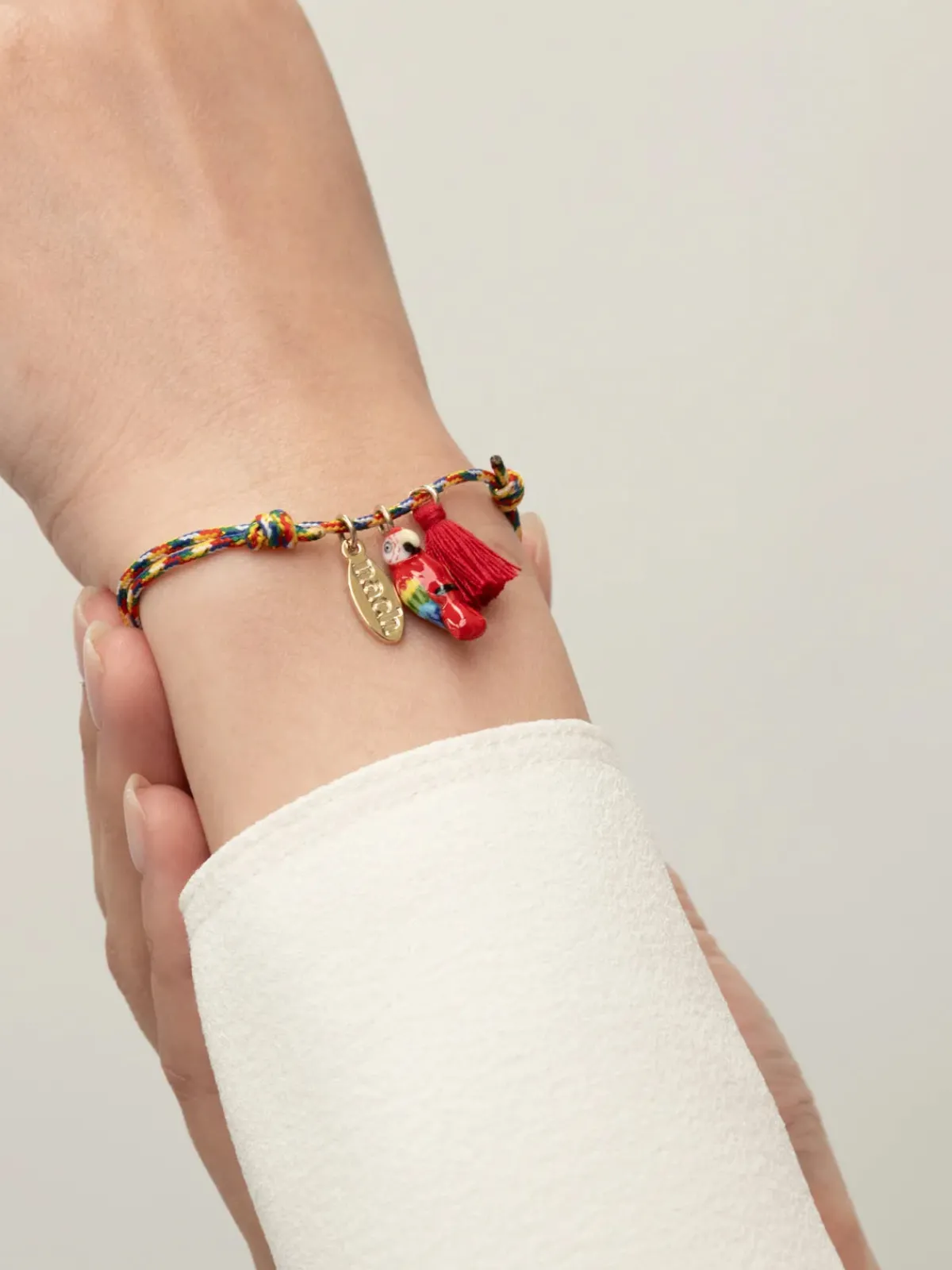 Multicolored cord bracelet with red parrot and tassel>NACH BIJOUX Clearance