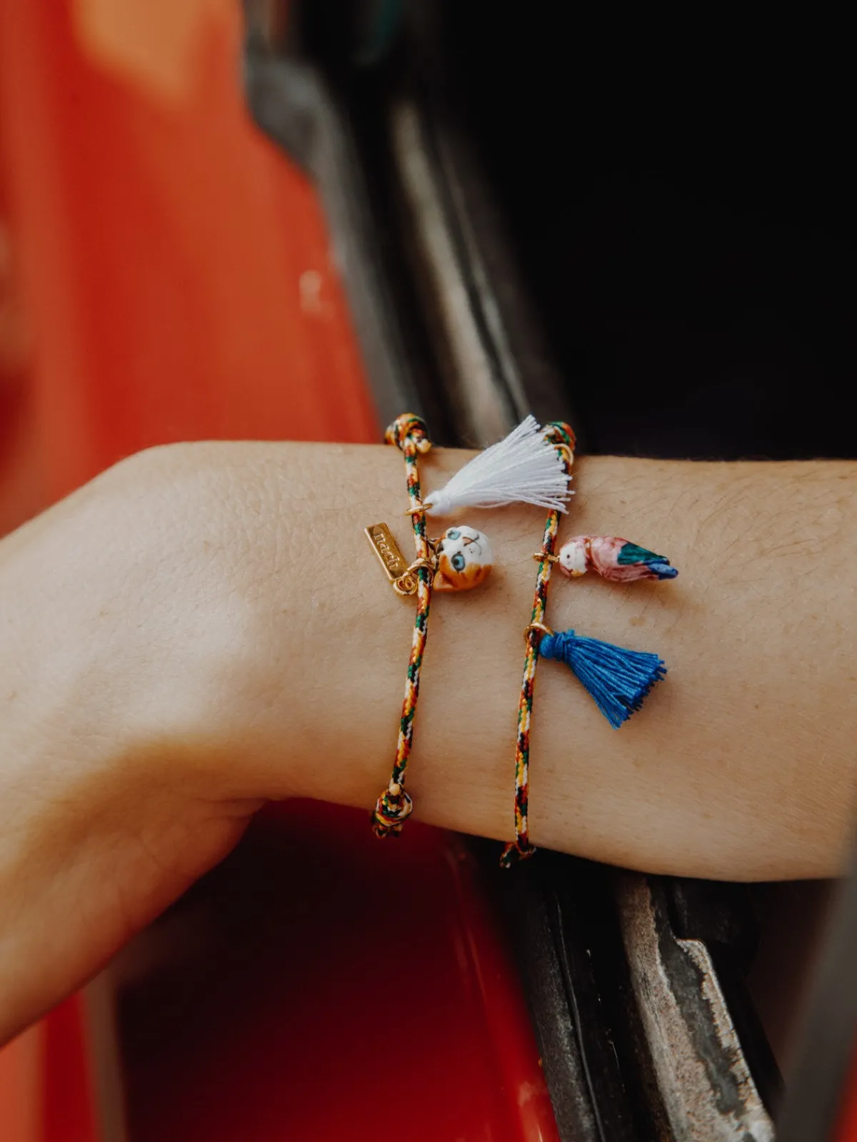 Multicolored pink parrot cord bracelet with tassel>NACH BIJOUX Online
